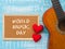 The guitar and board with WORLD MUSIC DAY text, red heart on blu