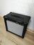 Guitar combo amplifier on the wooden floor