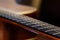 Guitar fretboard, detail with shallow depth of field