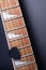 Guitar frets with strings and mediator on dark