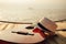 Guitar and hat on reed mat near the sea at sunset. Travel, vocation, holiday, summer concept