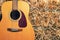 Guitar on a hay stack