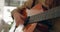 Guitar, music and hands with a woman playing a song inside as a musician, artist or performer closeup. Guitarist, live