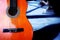 guitar orange color backgrounds wood shadow outdoors musical instrument arts culture and entertainment blue color nature light