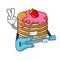 With guitar pancake with strawberry mascot cartoon
