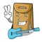 With guitar paper bag in the cartoon shape