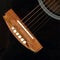 Guitar repair and service - Top view fragment broken bridge acoustic guitar