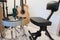 Guitar seat and stool in music practice room. Musicians chair