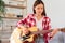 Guitar and singer concept, Young woman learning and practice playing chords with acoustic guitar