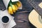 Guitar, yellow tulips, cup of coffee, musical page