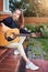 Guitarist girl play music on guitar. Beautiful singer