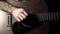 Guitarist hand touching guitar strings. Music performance. 4K video