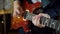 Guitarist hands playing electric guitar on concert stage
