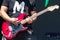 Guitarist play electricity guitar on concert stage