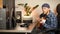 Guitarist playing acoustic guitar in living room. Happy musician sings song and plays chords on string instrument. Positive guitar