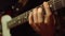 Guitarist playing acoustic guitar in studio. Musician rehearsing indoor.