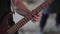 Guitarist plays solo on electric guitar. Close-up of guitar and hands