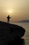 Guitarist at sunrise on the beach