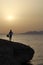 Guitarist at sunrise on the beach