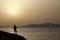 Guitarist at sunrise on the beach