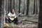 Guitarist in the woods at a picnic. A musician with an acoustic