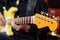 Guitarist with yellow Fender custom