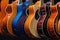 A Guitars hanging in a row on the wall