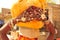 Gujarat: A young woman carring water on her head and showing her bracelets