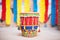a gujarati dhol drum decorated with colorful tassels