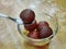 Gulab jamun serving in glass bowl, a milk-solid-based sweet from the Indian subcontinent, and a type of mithai. traditional Indian