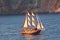 Gulet sailing at sunset near Santorini Island