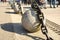 Gulf of Finland embankment with decorative granite balls with large metal chains in Petersburg on a clear spring day