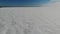 Gulf Finland ice with snow. footprints snow dunes. ski track. Winter Aerial