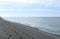 Gulf of Mexico clouds and beach footprints after sunrise