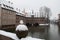 A gull on the bridge with Hospice of the Holy Spirit on background. Pegnitz river canal in winter. Nuremberg. Germany.