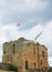 Gull flies near the ruins of the Medieval Tynemouth Priory and C