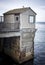 Gull on Rusted Pier and Building in California Seascape