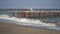 Gulls on the iron pier on the sea.