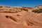 Gully in the Nevada desert surrounded by the colorful pink lined rocks