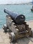 Gun barrel overlooking a blue sea