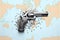 A gun with bullets on world map. Generative AI. Stop gun violence.