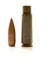 Gun cartridge with bullet and case on white background with reflexion