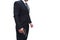 A gun man side view in a black suit standing with a pistol in a stern pose, on a white background. Concept for assassin,