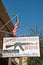 Gun shop sign in West Yellowstone, firearms regulation concept