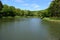 Gunderath, Germany - 05 19 2020: Heilbachsee in spring with fishing platforms and barbecue area in baclground