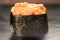 Gunkan Maki Sushi with Seafood, caviar and Spicy Sauce. Spicy gunkan with tuna isolated on black. Delicious Gunkan Sushi