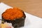 Gunkan with orange caviar wrapped in nori seaweed