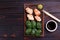 Gunkan sushi set with chuka and shrimps served on clay plates wi