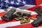 Guns and bullets , Semi automatic pistol handguns with ammunitions on an american flag background