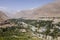 Gunt River with the city of Khorog in the Wakhan valley in Tajikistan with the Pamir mountains